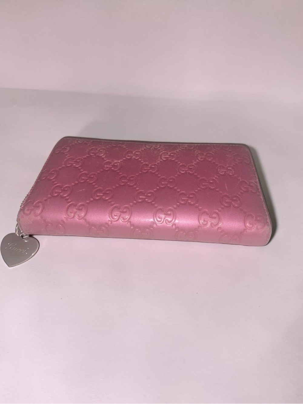 Gucci Pink Embossed GG Zip-Around Wallet with Heart Charm